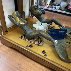 decorative mermaid sculptures, likely bronze, featuring a two-tone finish with golden hair and patinated green bodies