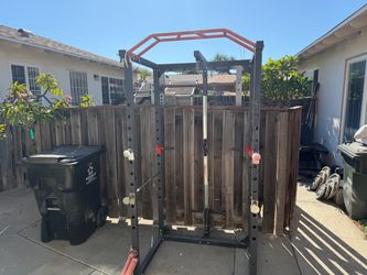 Squat rack with pull up bar dips and pully