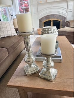 Mercury glass candle sticks with candles