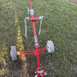 Wilson’s Folding Rolling Golf Bag Caddy