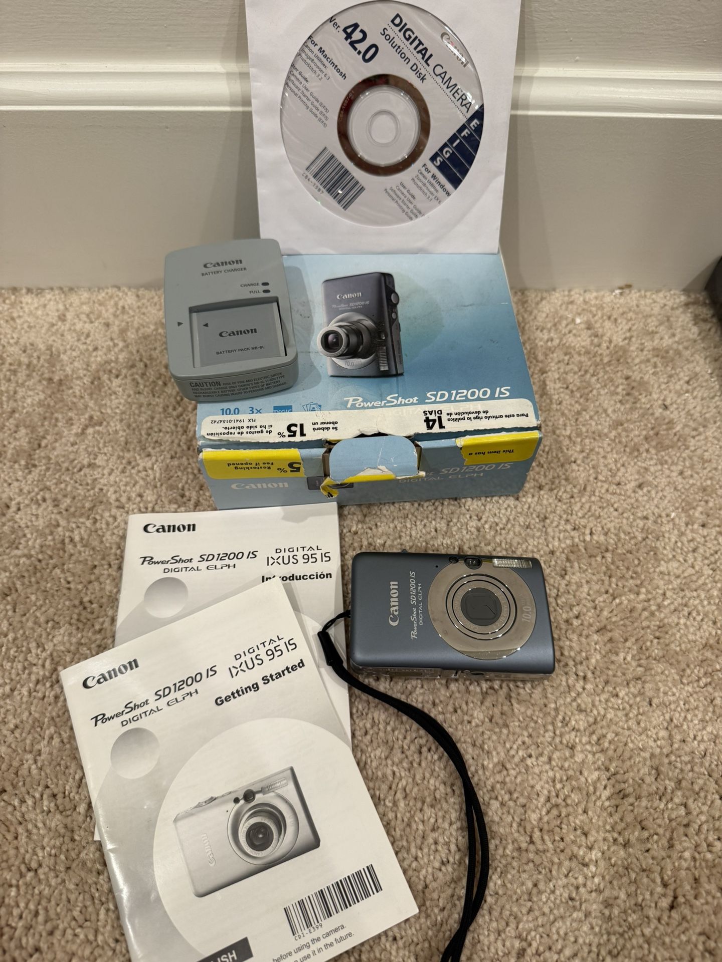 Canon PowerShot SD1200 IS Digital Camera is a 10.0-megapixel in boxwith charger