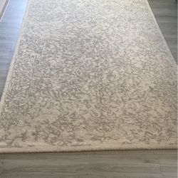 100 percent wool  Grey and white rug