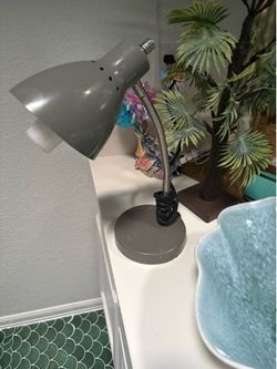 Gray desk lamp with bulb
