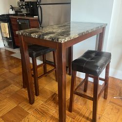 Wayfair wooden counter height table with two leather barstools