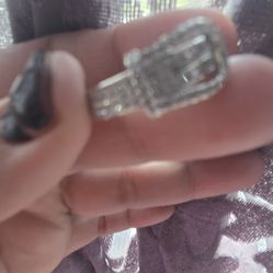 A new chicken, shiney silver plated ..shaped like belt ring size 9