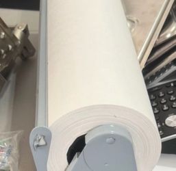 Paper roll in metal holder