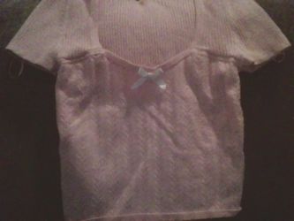 a pink short sleeve top size M you will have to message me for when u can pick it up