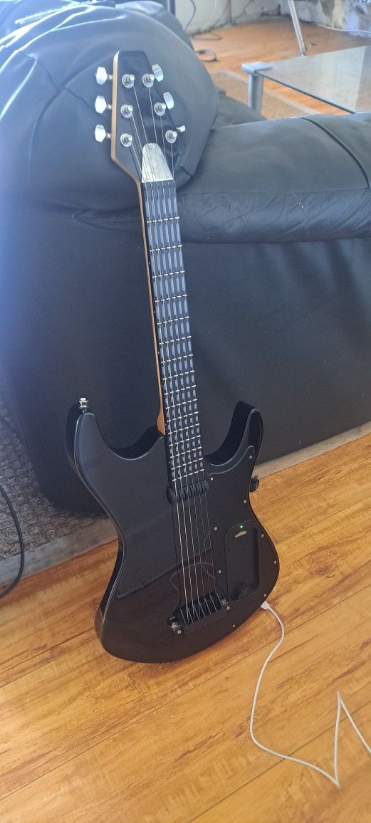 Learn Guitar With The Gtar Guitar. Hooks Up To i Phone.