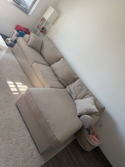 Beige home goods couch with chaise