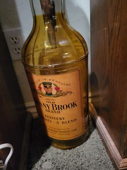 Display bottle from the nineteen forties, very thick glass, large and d has a beer tap of an eagle with it