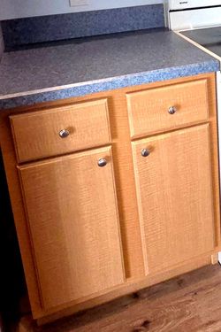 Preown Kitchen Base cabinet in Honey Birch color. For organization in the kitchen, garage, bedroom, bathroom, or a office.