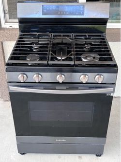 Samsung Black Stainless Steel Gas Range and matching microwave