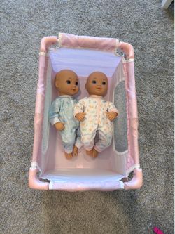 Playpen and baby dolls