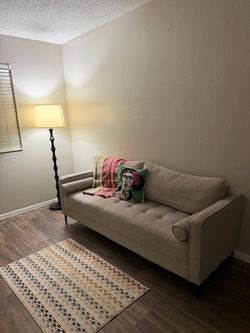 Beige Tufted Sofa with Dark Legs
