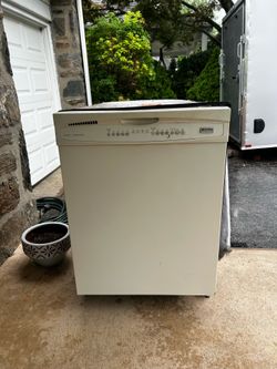 Kenmore beige dishwasher with  stainless interior