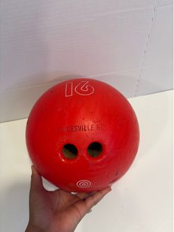 red 16-pound bowling ball branded with "GAINESVILLE BC