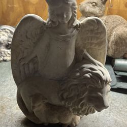 Angle And Lion Statue