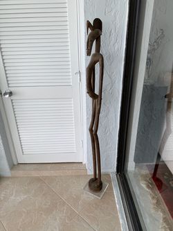 Tall African carved wood sculpture