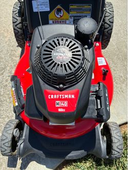 Craftsman push lawnmower with Honda engine starts right up runs perfect truly like new a must see.