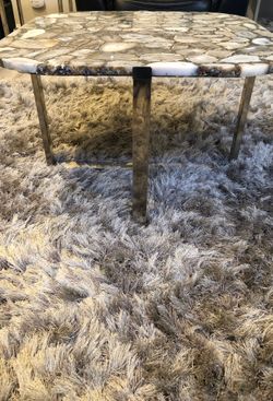 Stone cut coffee tables with chrome legs $400.00 for both .