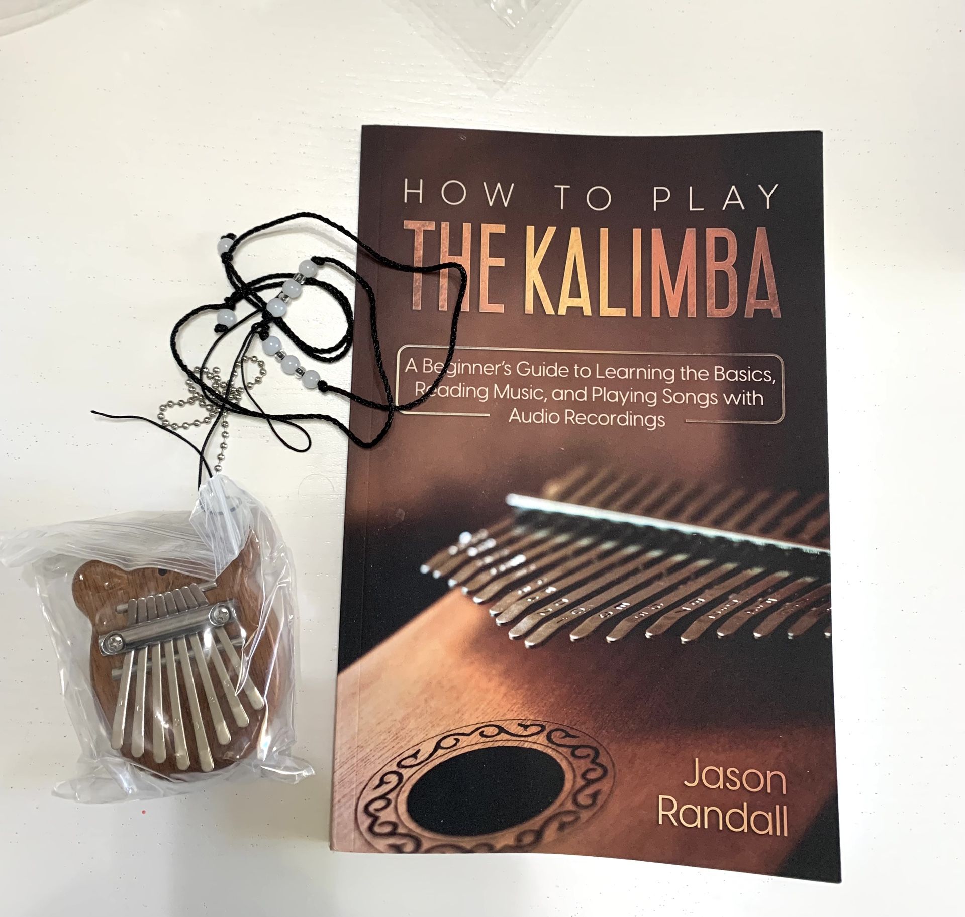 THE KALIMBA MUSICAL INSTRUMENT WITH HOW TO LAY BOOK / BRAND NEW