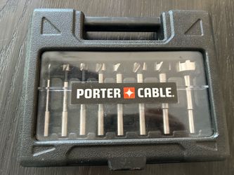 Porter-Cable 8-piece Forstner bit set housed in a black plastic carrying case
