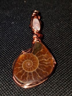 Fire ammonite and moonstone copper wrapped pendant