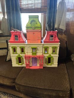 Vintage fisher-price folding grand mansion doll house.
