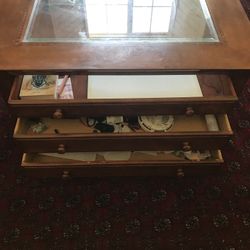 Brown coffee table with glass top