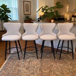 Set of 4 Swivel Wingback Bar Stools with Nailhead Trim