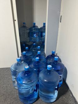 5 gallon water jugs with water
