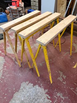 Yellow Metal Folding Sawhorses with Timber Boards
