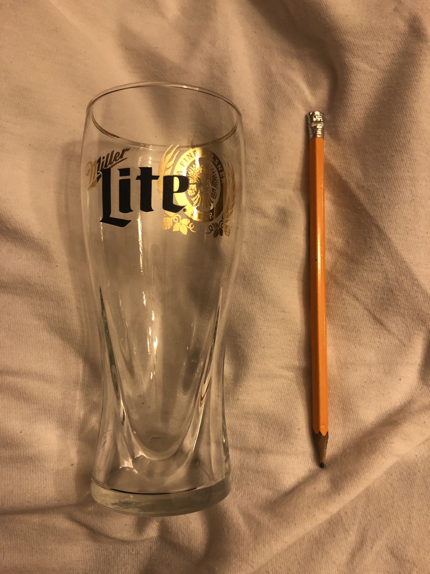 A pair of Miller time collector golden rim touched beer glass