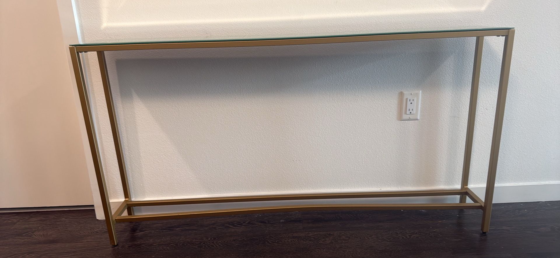 Long narrow mirrored console table with gold frame