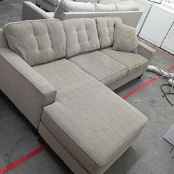 Small brown sectional couch