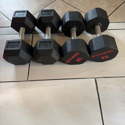 Rubber dumbbells pairs of 45lbs and 50lbs weights