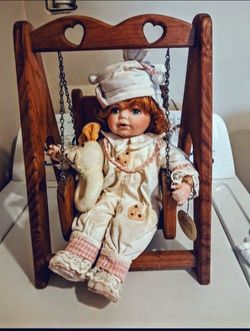 Porcelain Baby Doll with Wooden Swing Stand