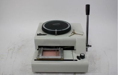 Credit card embossing machine