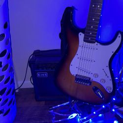electric guitar with speaker (cord included)