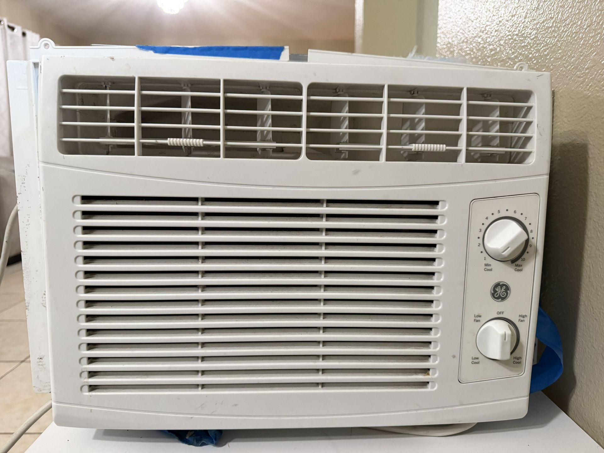 This is a GE 5,000 BTU mechanical window air conditioner
