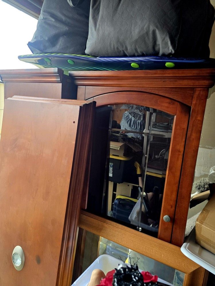 Wooden Entertainment Center With Glass Doors