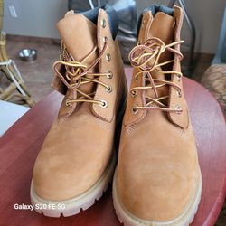 Boots size 8 is waterproof, great for working or gardening, hiking, or just for wearing. Made by Timberland. New boots, never worn.