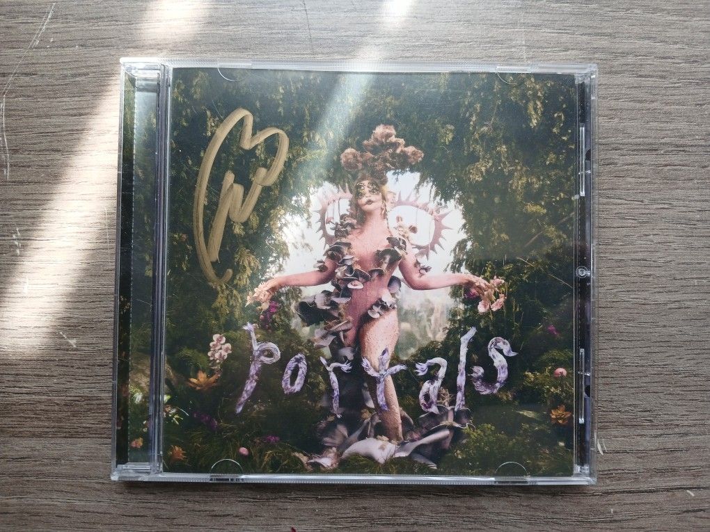 Hand signed Melanie Martinez CD