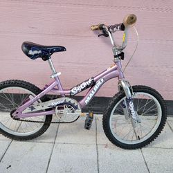 18" girl's purple bike.