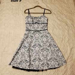 Strappy Dress Is Size 9. Blue Floral Dress Is Size Medium.
