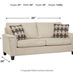 Cream-colored Abinger Sofa (by Ashley Furniture)