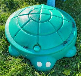 Green sandbox with lid