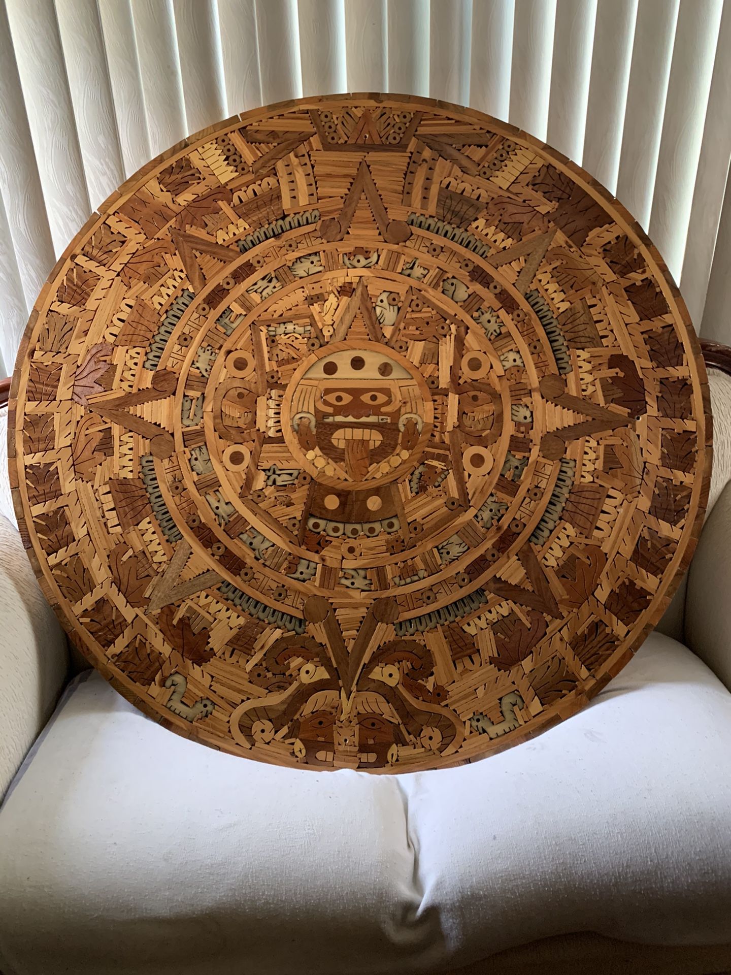 Handcrafted wooden Aztec calendar