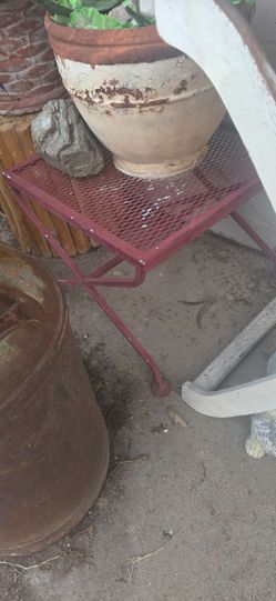 Wrought iron patio furniture...2 dining tables, one small table. A glider swing and all chairs seen