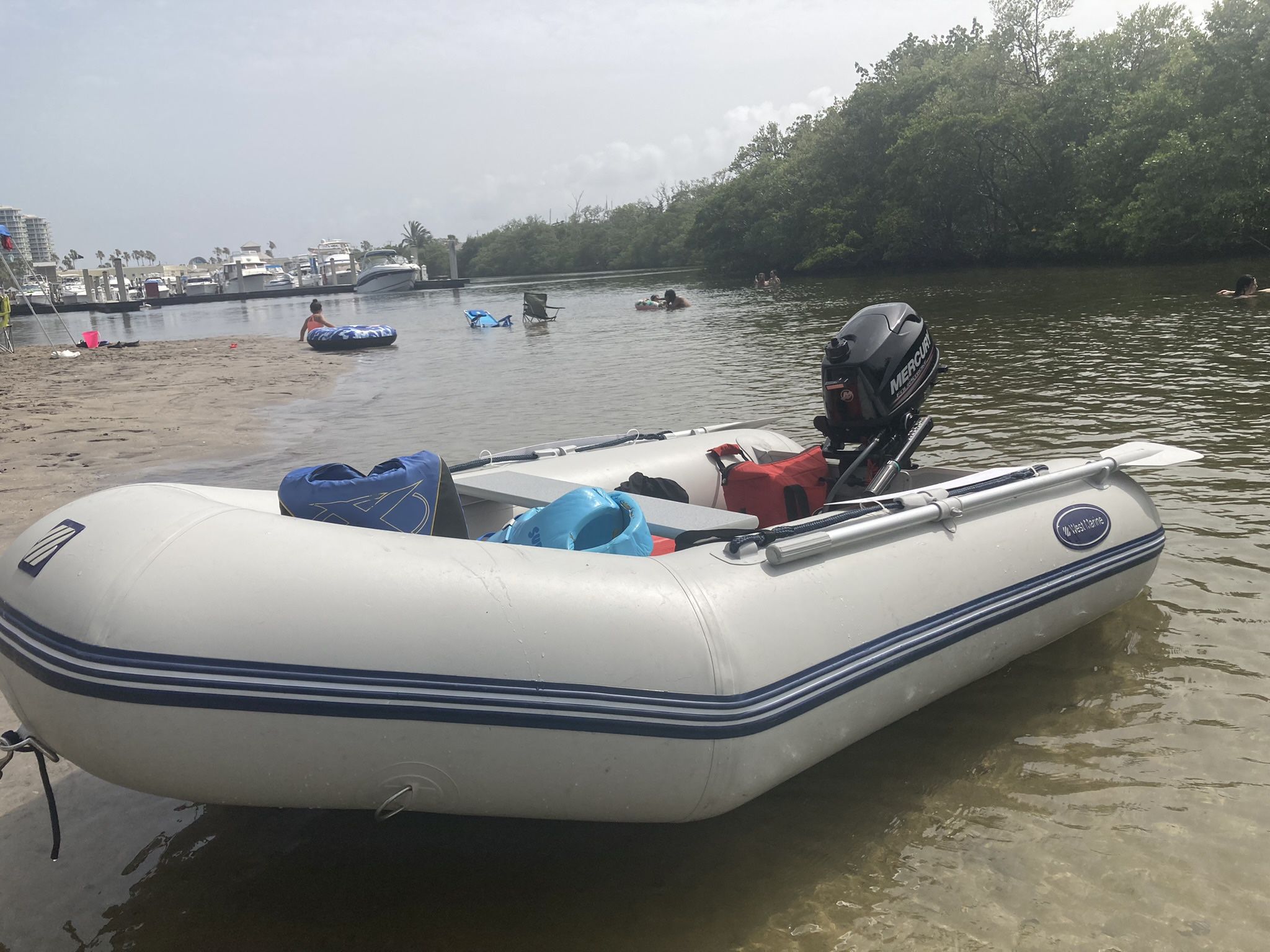 Outboard And Inflatable  Boat And  Mercury Motor 